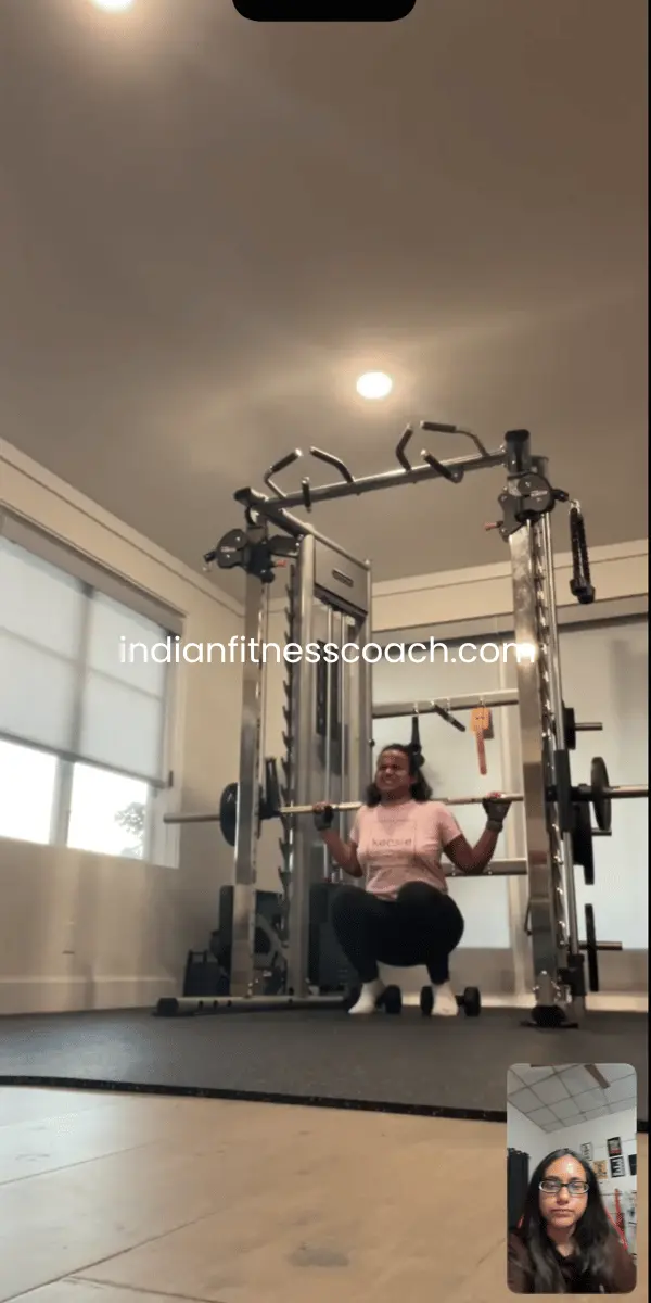 Client doing Smith machine squats during a live IFC training session