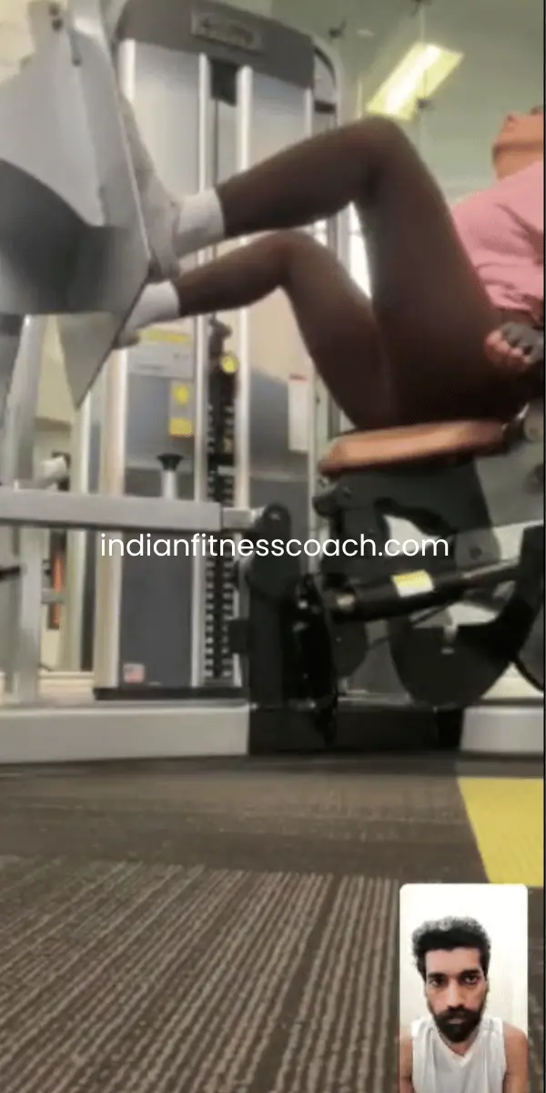 Client doing seated leg press during a live IFC training session
