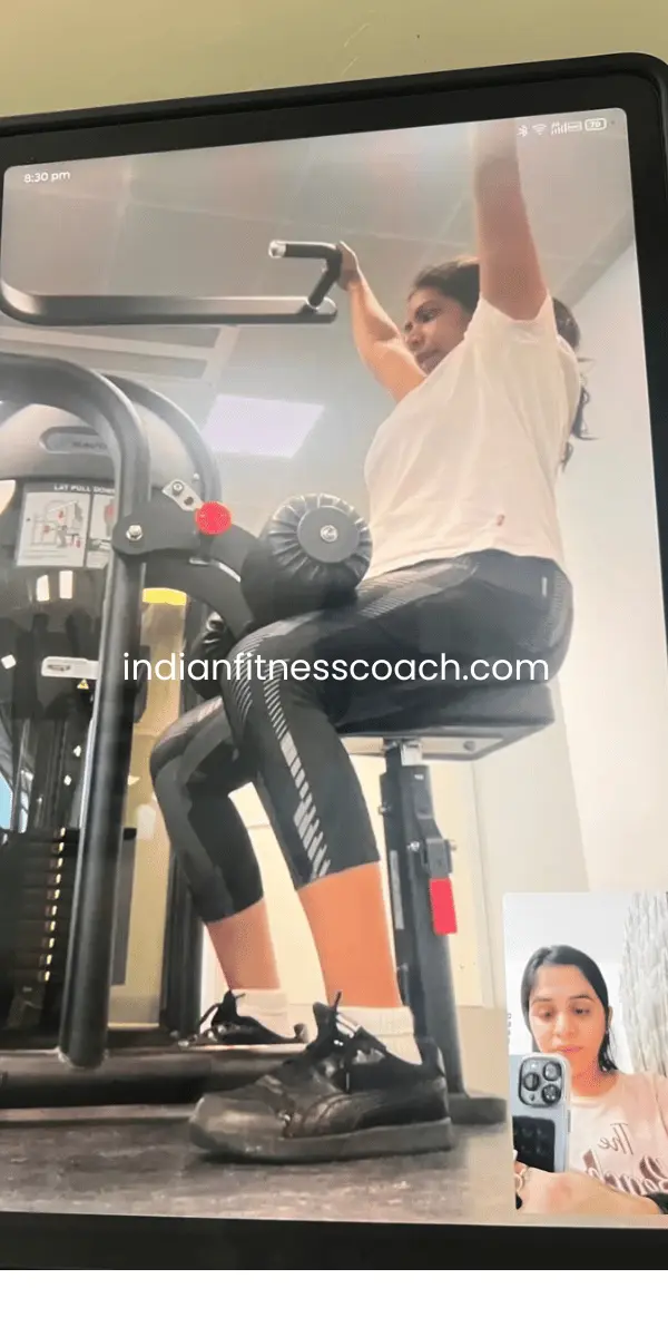 Client doing lat pulldowns during a live IFC training session